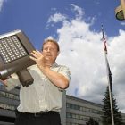 fred_barnett_holds_led_light_fixture080511toby_ap11080508747.jpg